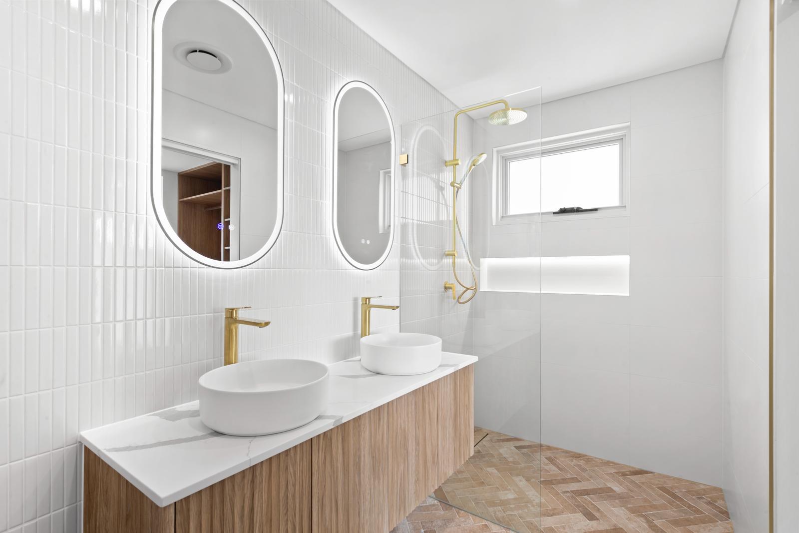 Ensuite double vanity with pill mirrors and gold tapware, Malabar project