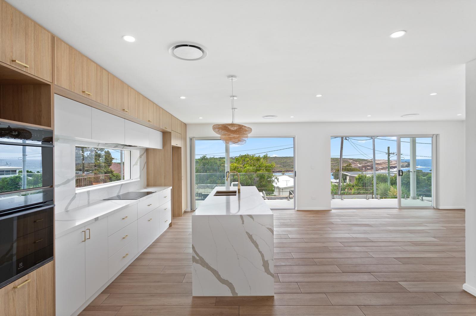 Open-plan kitchen and living with ocean views — Malabar