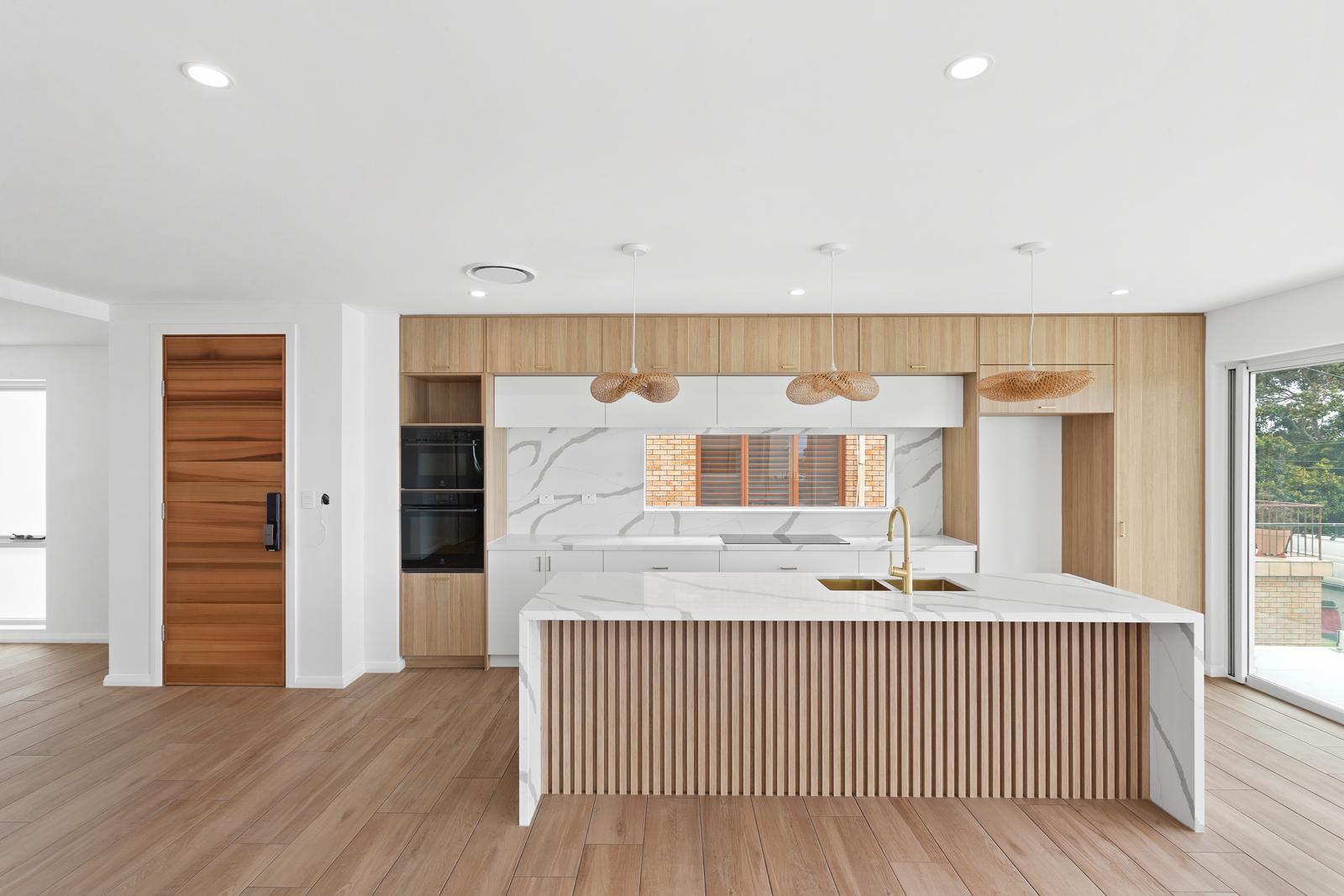 Velocity CG completed kitchen renovation with stone island, timber cabinetry and ocean views — Malabar project